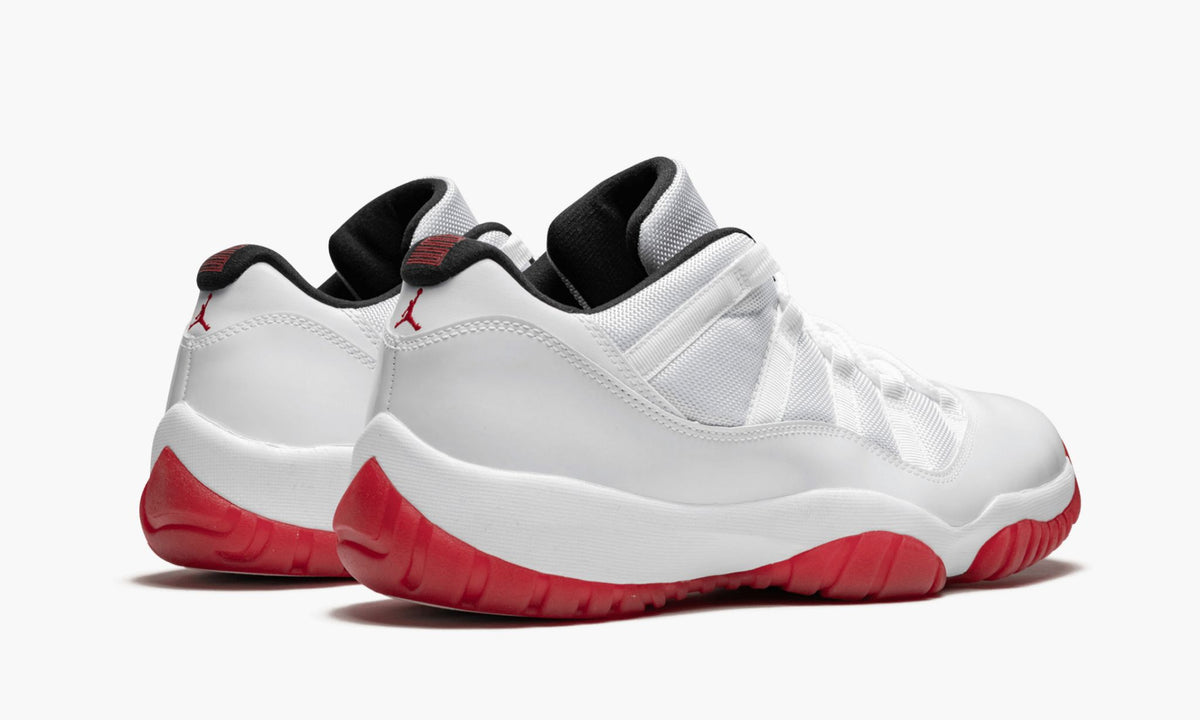 Air Jordan 11 Retro Low White/Varsity Sneakers in Red - product image from the listing.