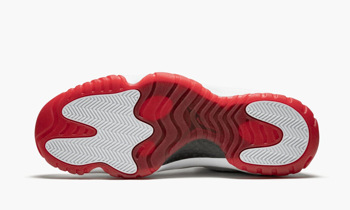 Air Jordan 11 Retro Low White/Varsity Sneakers in Red - product image from the listing.
