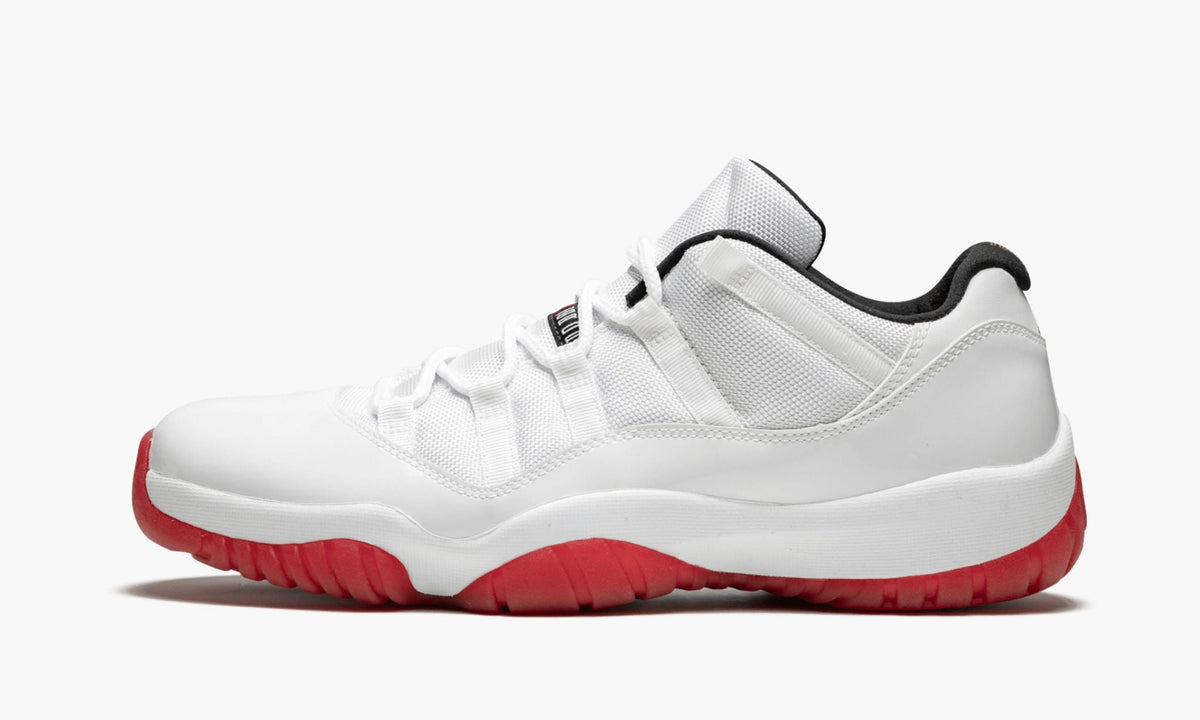 Air Jordan 11 Retro Low White/Varsity Sneakers in Red - product image from the listing.