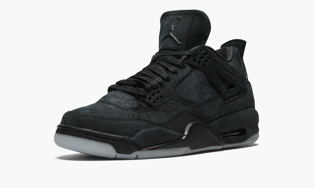 Black Sneakers - Air Jordan 4 Retro Kaws - product image from the listing.