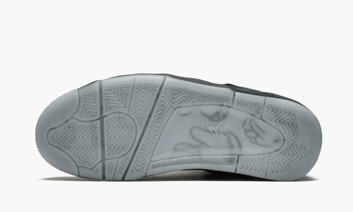 Black Sneakers - Air Jordan 4 Retro Kaws - product image from the listing.
