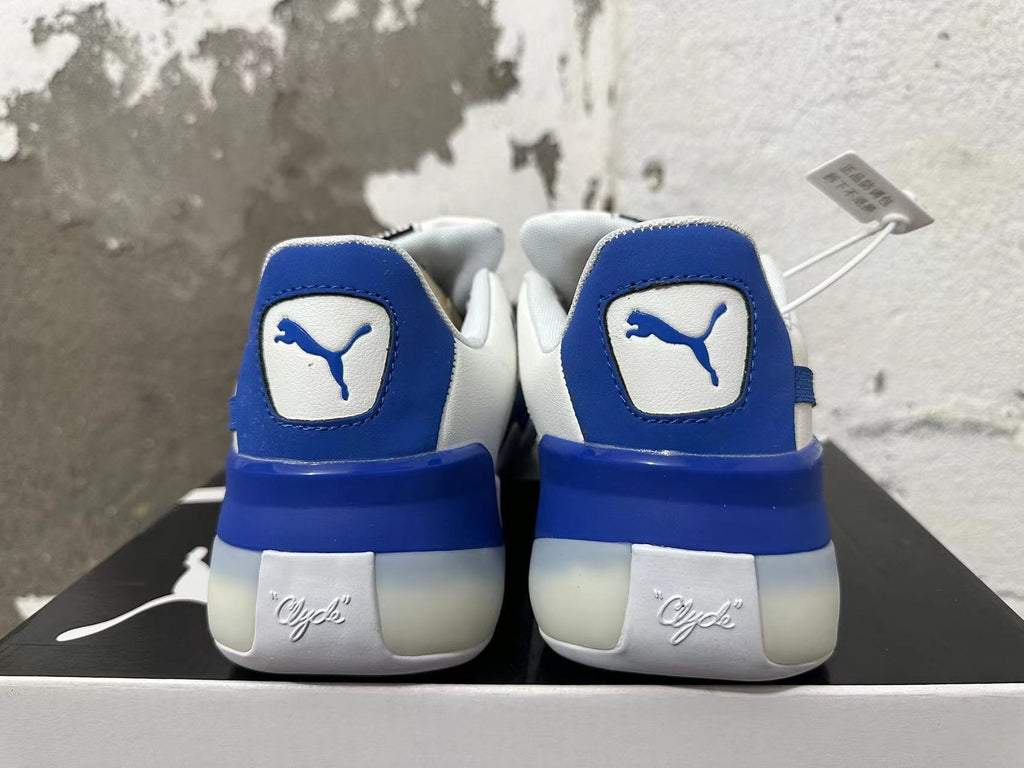 Puma Clyde Sneakers in White and Blue - product image from the listing.