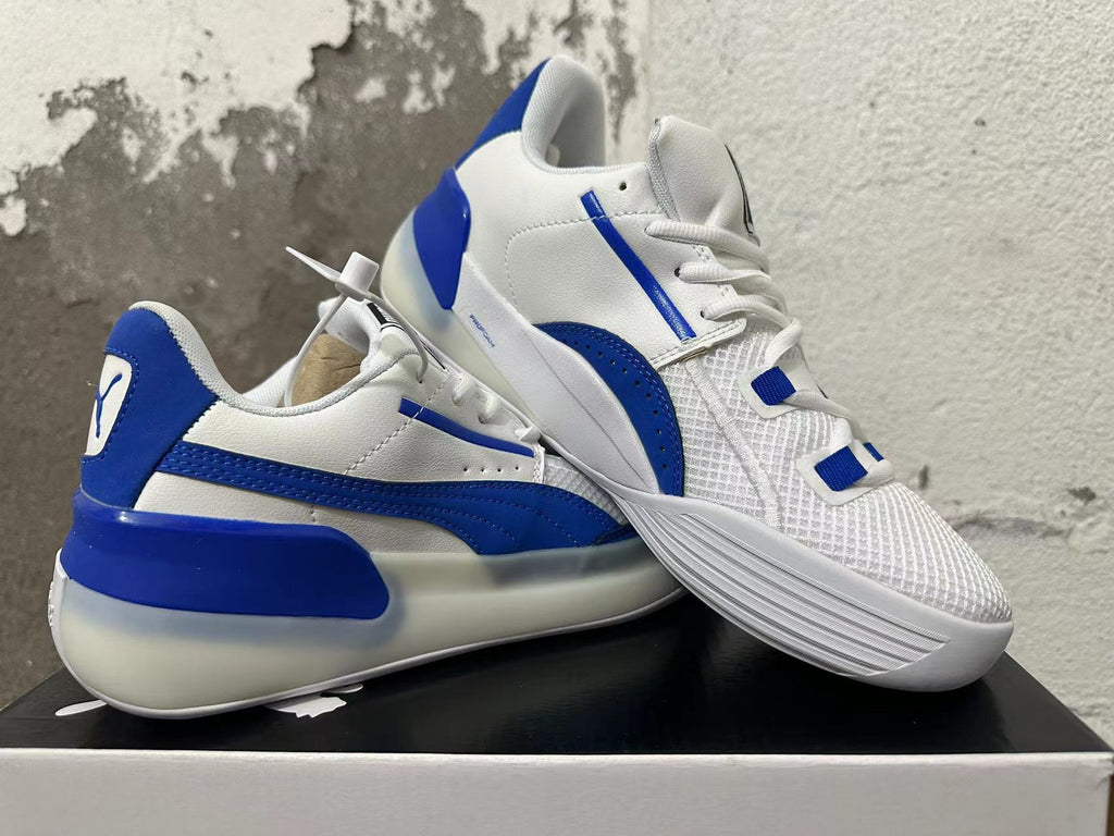 Puma Clyde Sneakers in White and Blue - product image from the listing.