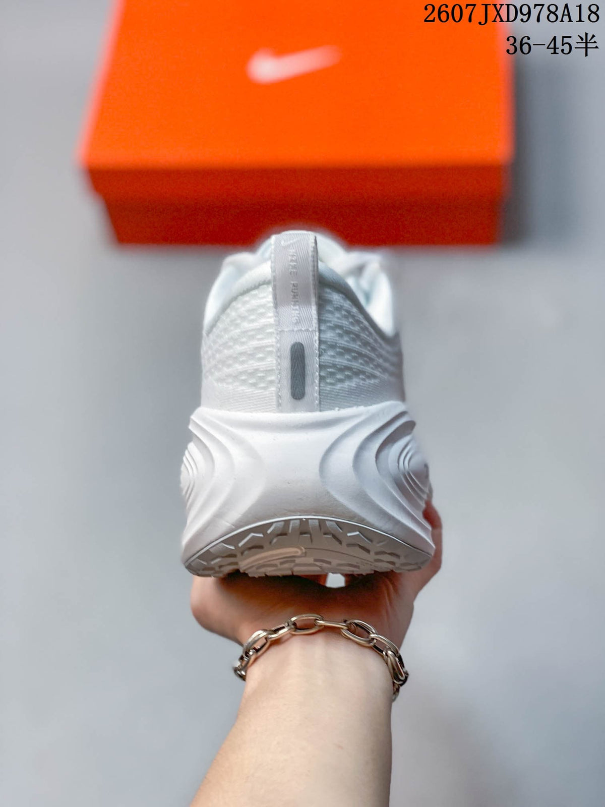 Nike Vomero Plus Running Shoes in White JXD978A18 - product image from the listing.