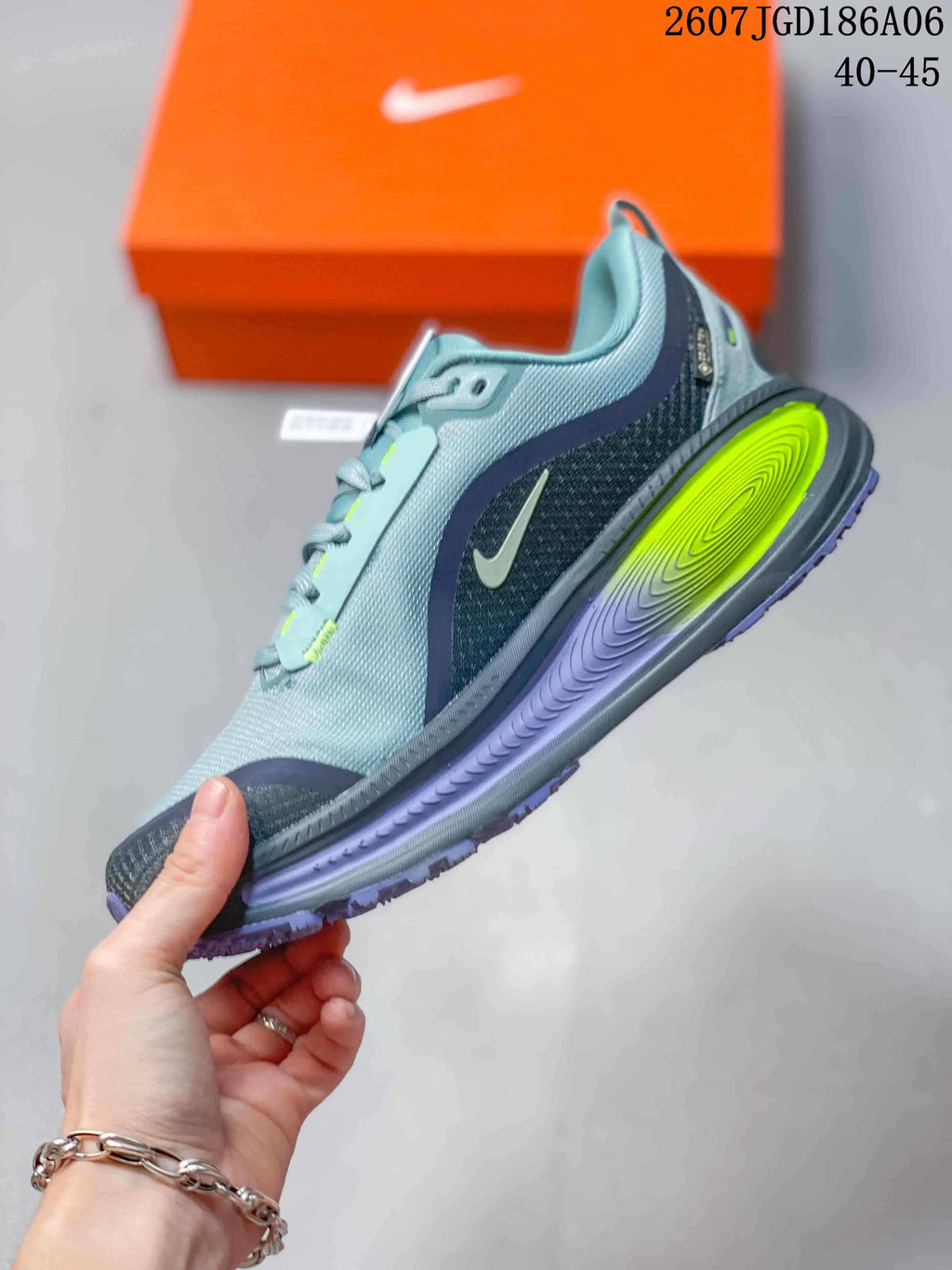 Nike Vomero Plus Run Running Sneakers in Gray - product image from the listing.