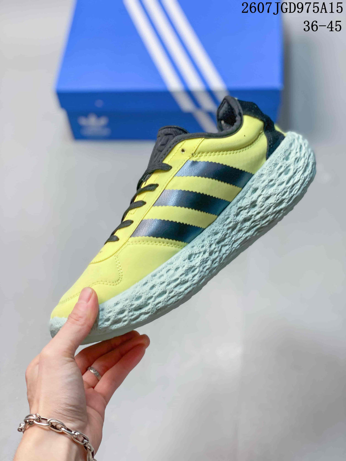 Adidas Zponge Low-Top Sneakers in Yellow Black IH0977 - product image from the listing.
