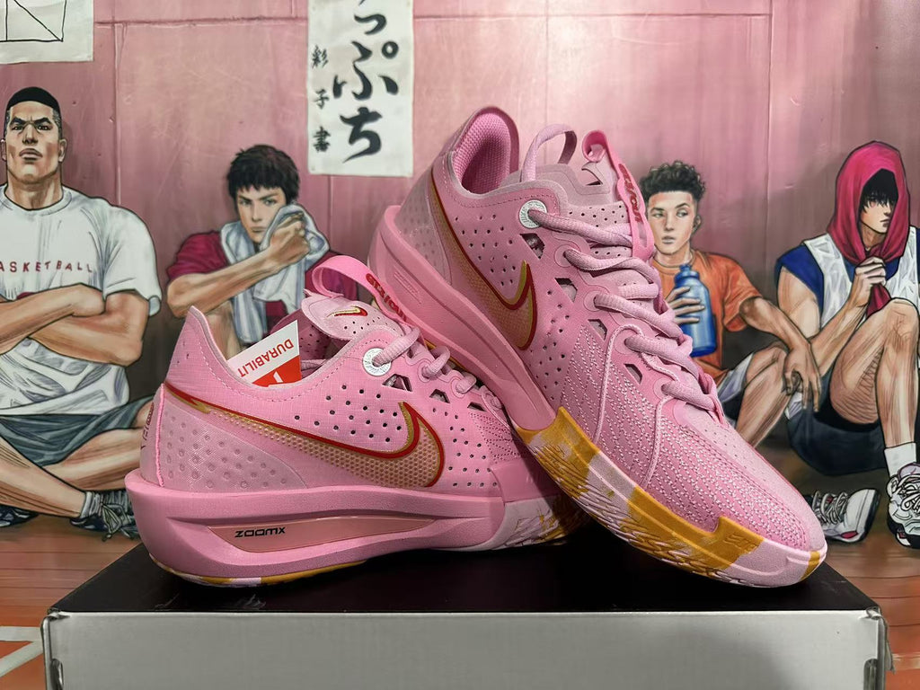 Pink and Gold Nike Basketball Shoes - product image from the listing.