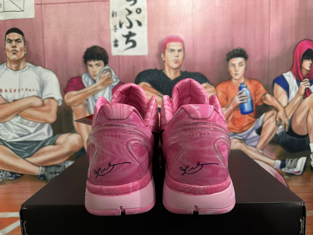 Nike Pink Basketball Trainers with Black Swoosh - product image from the listing.