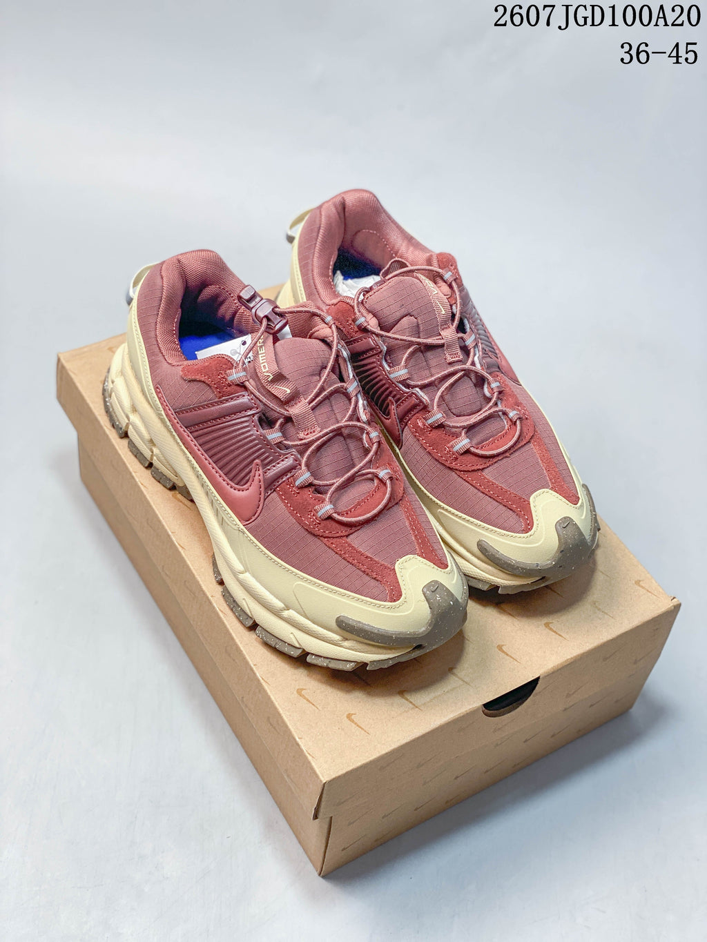 Nike Zoom Vomero Roam Sneakers in Burgundy Cream 2607TGD100A20 - product image from the listing.