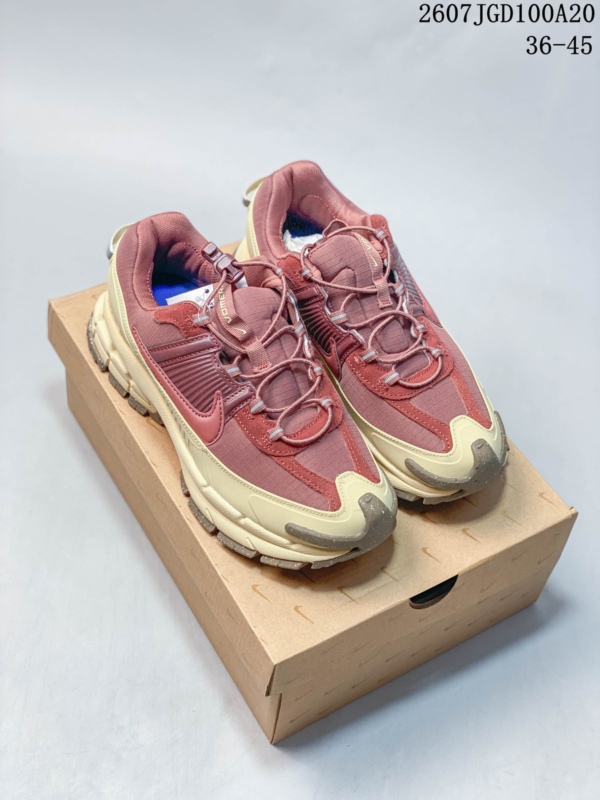 Nike Zoom Vomero Roam Sneakers in Burgundy Cream 2607TGD100A20 - product image from the listing.