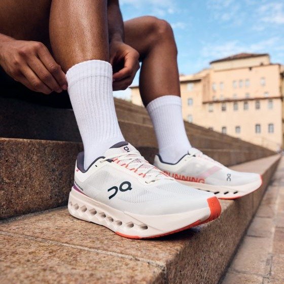 On Cloudsurfer Next Running Shoes in White Orange - product image from the listing.