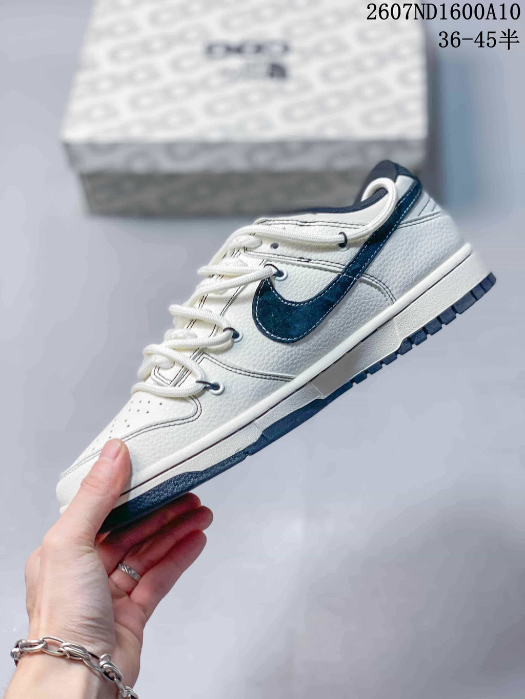 Nike SB Dunk Low Sneakers in White Navy 2607ND1600A10 - product image from the listing.