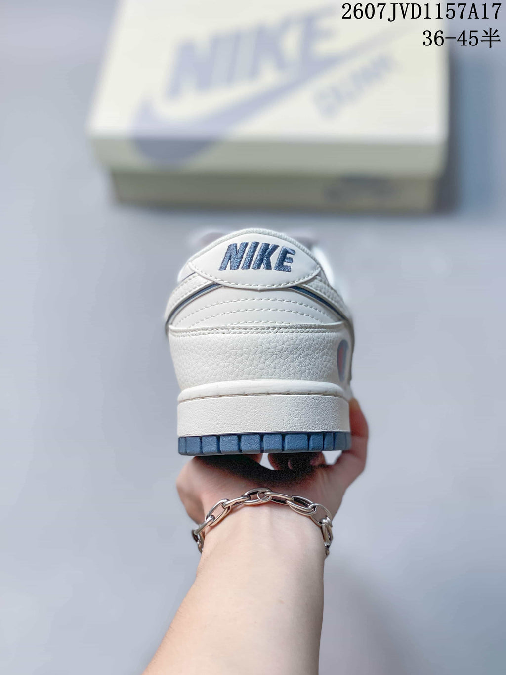 Louis Vuitton x Nike Dunk Low Sneakers in White Blue - product image from the listing.