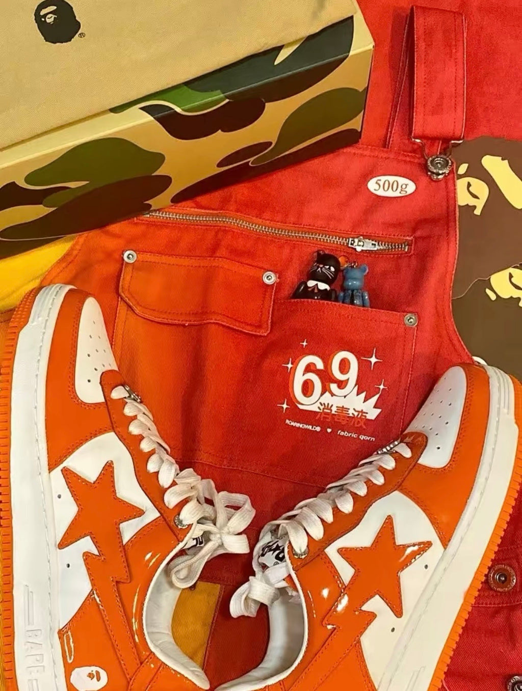 A Bathing Ape BAPE STA Low Sneakers in White Orange - product image from the listing.
