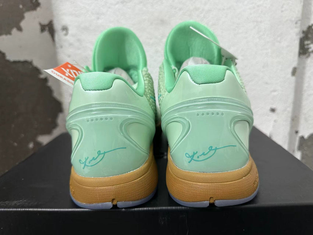 Nike Kobe 6 Basketball Shoes, in Mint Green and Gum - product image from the listing.