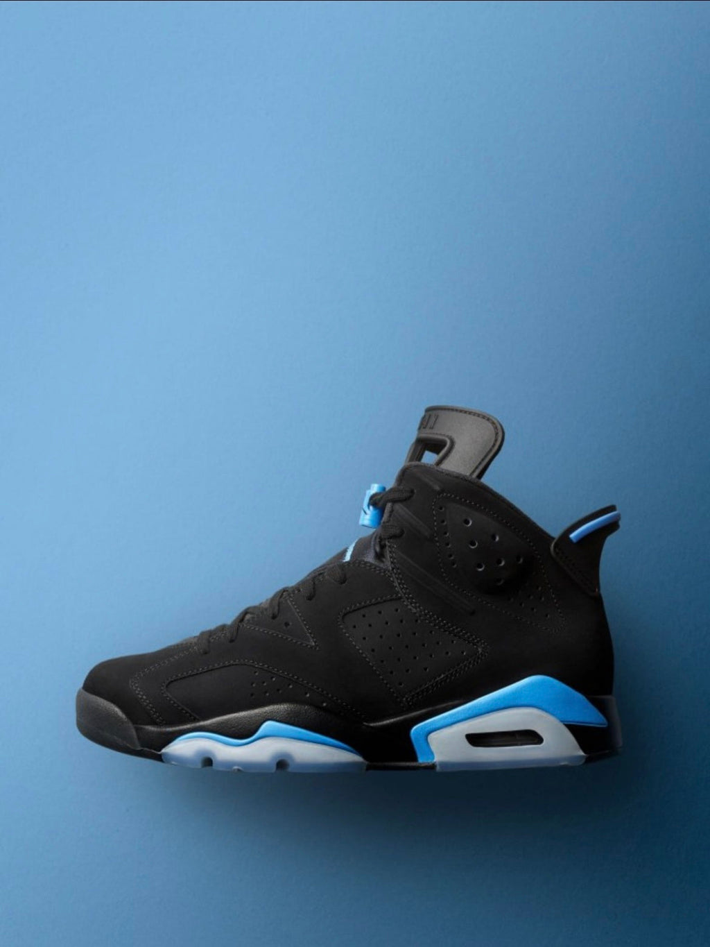 Air Jordan 6 UNC Black and University Blue Sneakers - product image from the listing.