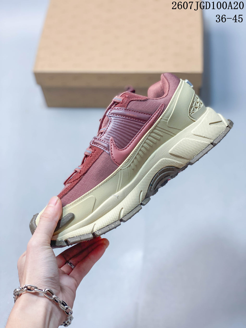 Nike Zoom Vomero Roam Sneakers in Burgundy Cream 2607TGD100A20 - product image from the listing.