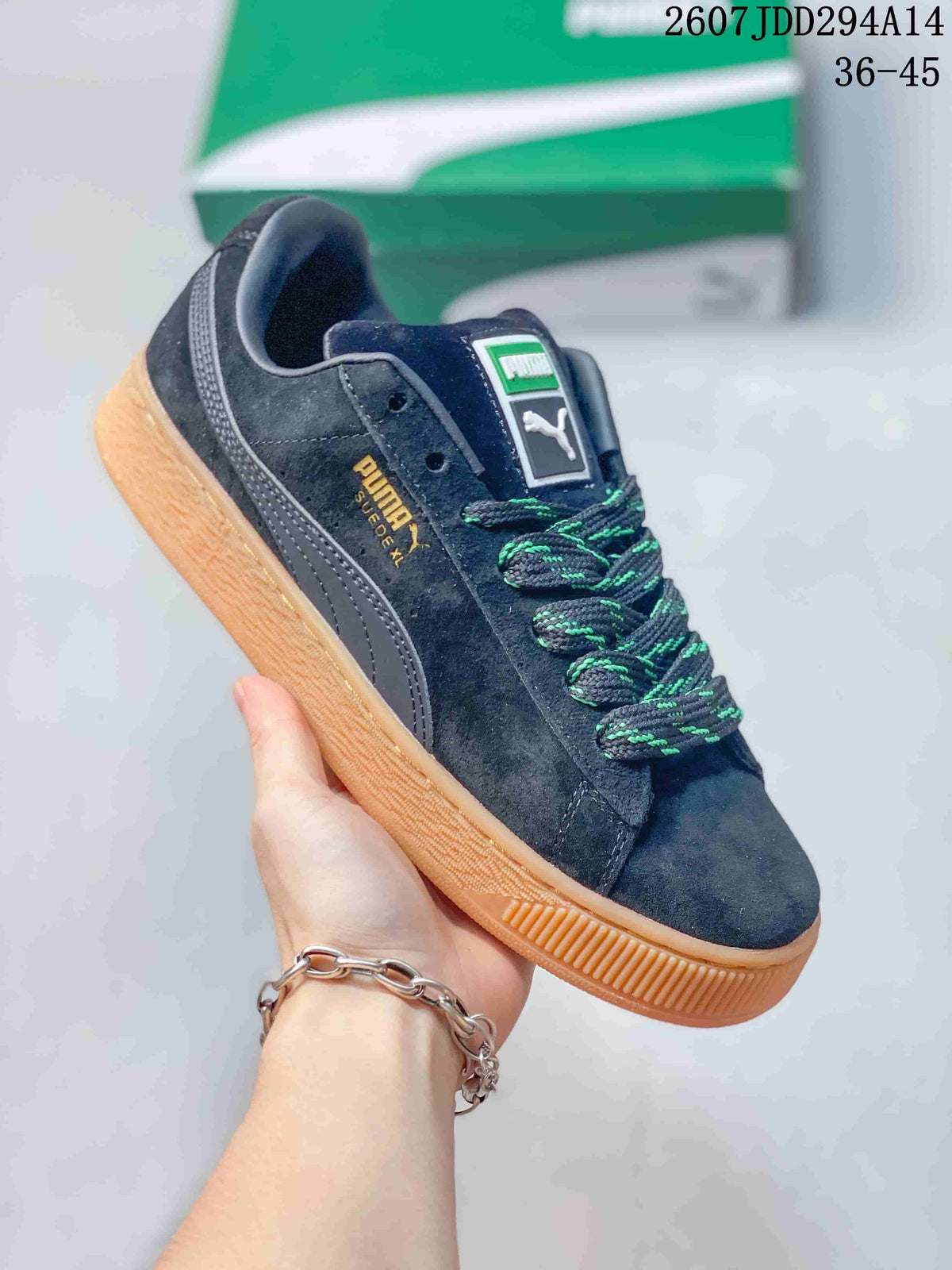 PUMA Suede XL Low-Top Sneakers in Black and Gum - product image from the listing.