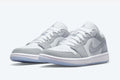 Jordan 1 Low Sneakers in Wolf Grey - product image from the listing.