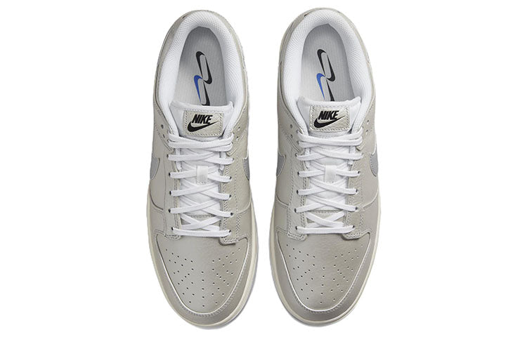 Nike Dunk Low Sneakers in Metallic Silver - product image from the listing.
