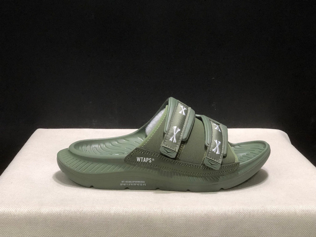 WTAPS x HOKA ONE ONE Ora Luxe Slide Sandals - product image from the listing.