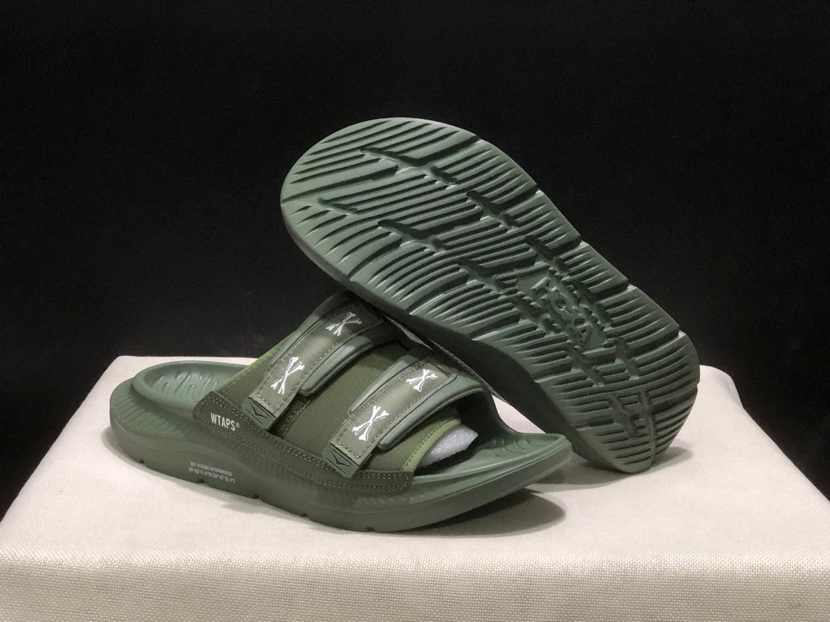 WTAPS x HOKA ONE ONE Ora Luxe Slide Sandals - product image from the listing.