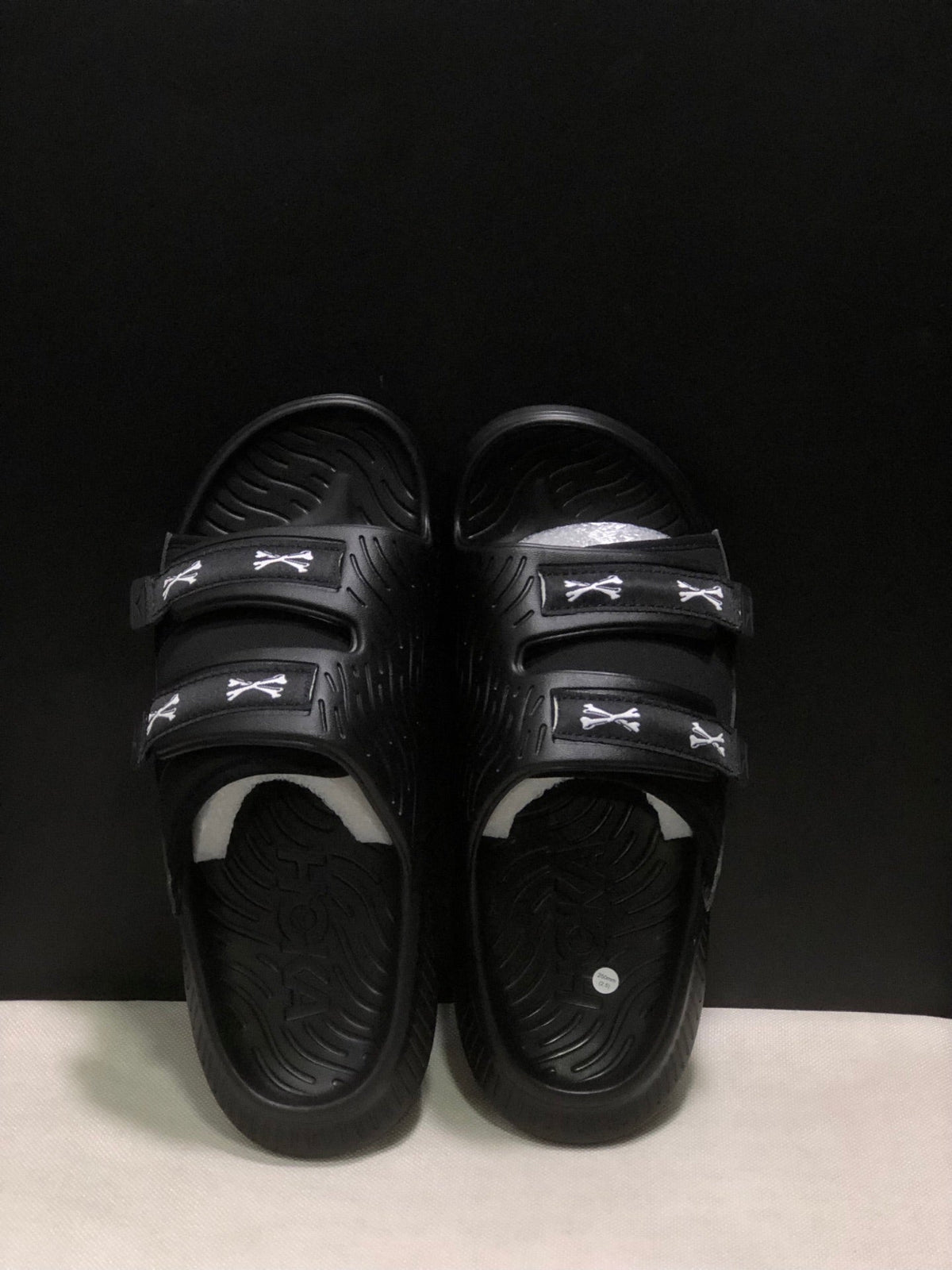 WTAPS x HOKA ONE ONE Ora Luxe Slide Sandals - product image from the listing.