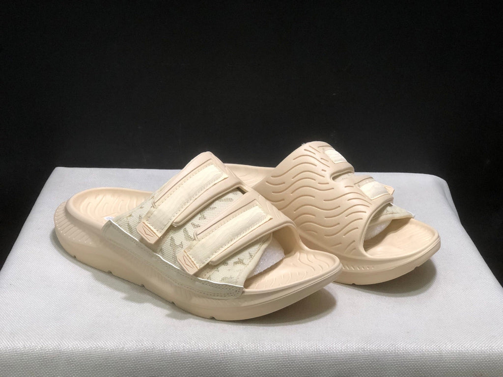 WTAPS x HOKA ONE ONE Ora Luxe Slide Sandals - product image from the listing.