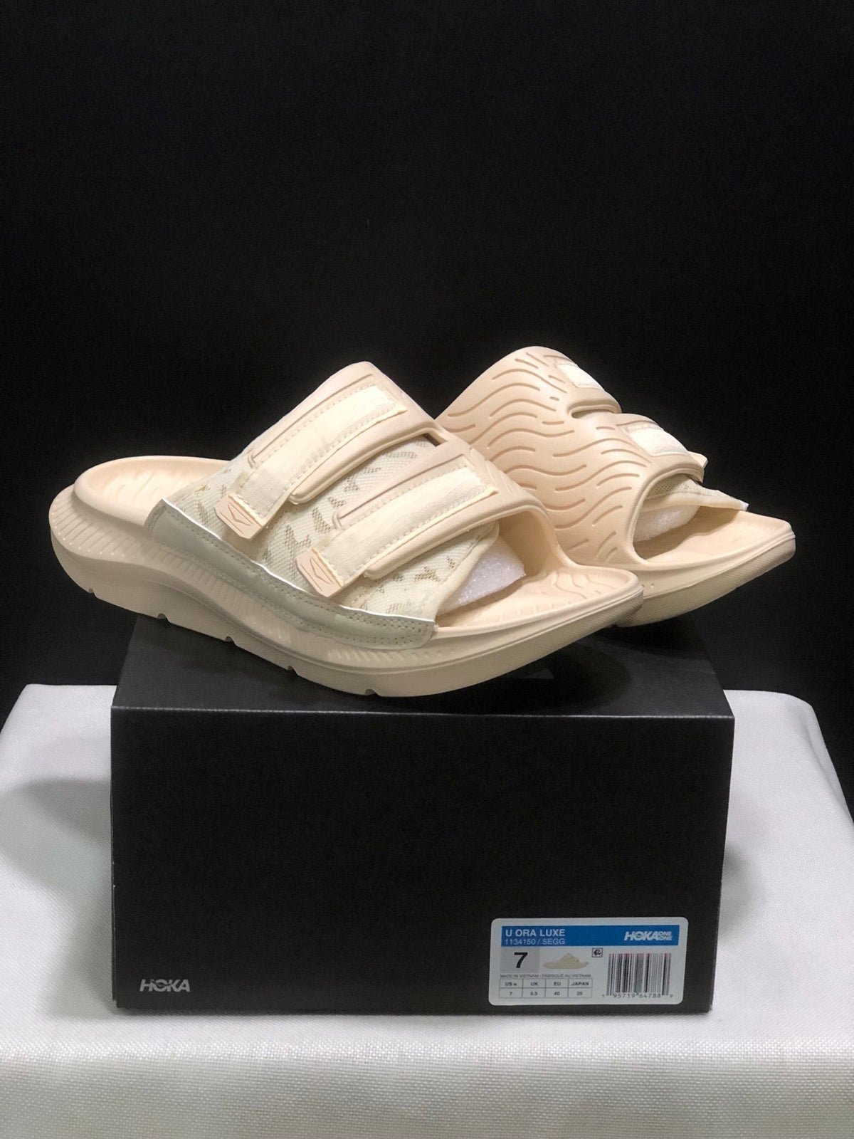 WTAPS x HOKA ONE ONE Ora Luxe Slide Sandals - product image from the listing.