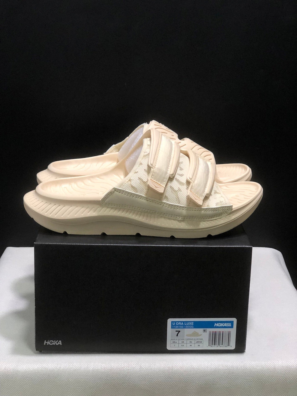 WTAPS x HOKA ONE ONE Ora Luxe Slide Sandals - product image from the listing.